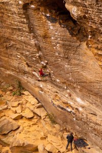 Often, a crag's most striking lines - the "dream routes" - require completing numerous difficult moves without rest.  This "power-endurance" can be developed with the right training. Paul Nelson climbs 8 Ball at the RRG.