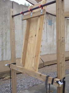 Rear view, detailing the load-bearing hooks, and the lower horizontal support beam.